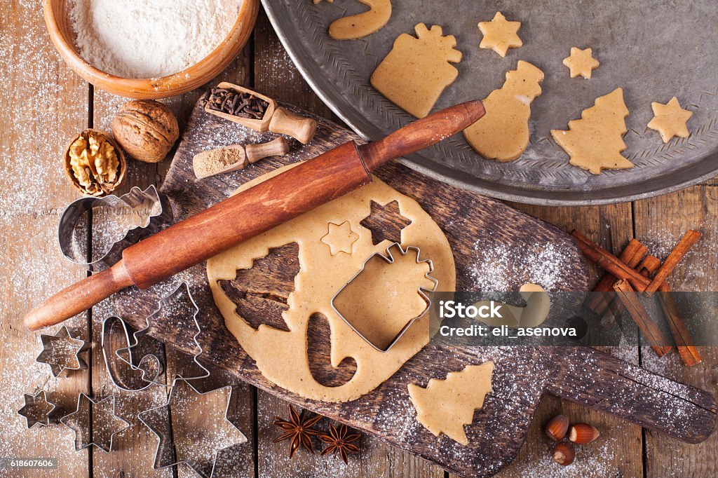 Making Christmas Cookies with traditional gingerbread cookies ingredients Christmas Stock Photo