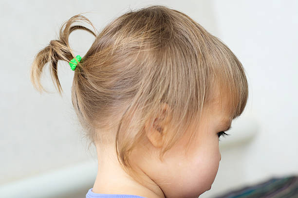 First Hair Style Tiny Ponytail Profile Of Baby Girl Stock Photo - Download  Image Now - iStock