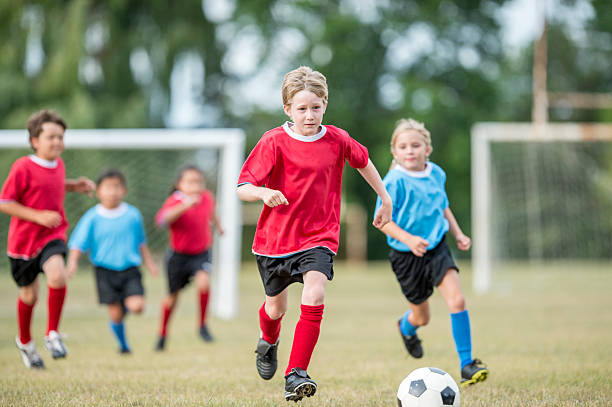 istock Dribbling the Ball Up the Field 618608726