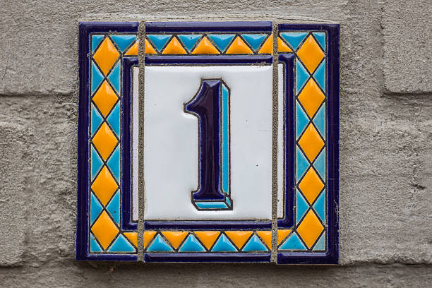 istock House number one . Blue lettering on a white plate 618608926