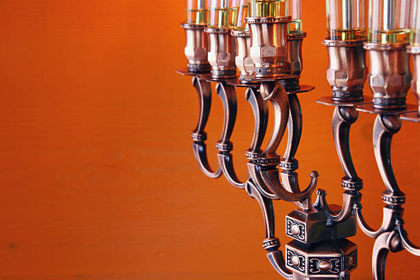 Low key Image of jewish holiday Hanukkah background with menorah (traditional candelabra) and burning candles