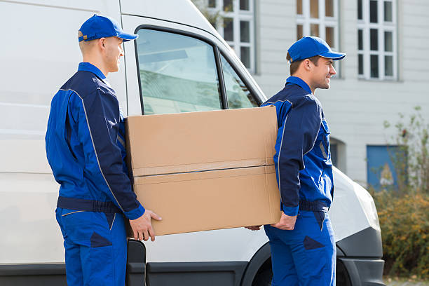 istock Delivery Men Carrying Cardboard Box By Truck 618610358