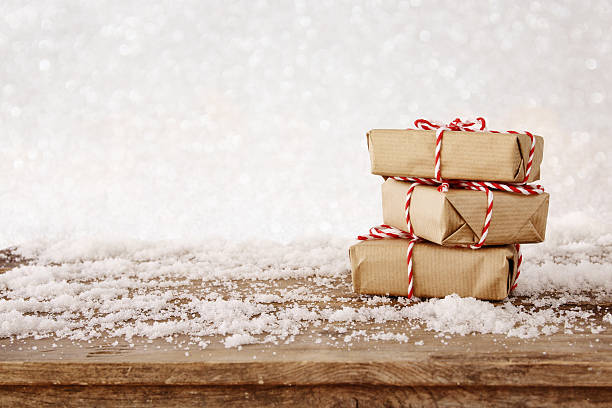 istock handmade gift boxes over snowy wooden table 618611006