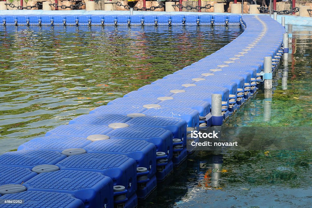 Many blue float buoy arrange in lake for walkway Blue Stock Photo