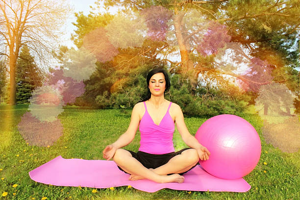 istock Woman meditating outdoors 618612740