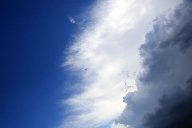 istock Blue sky with clouds background and airplane 618613444