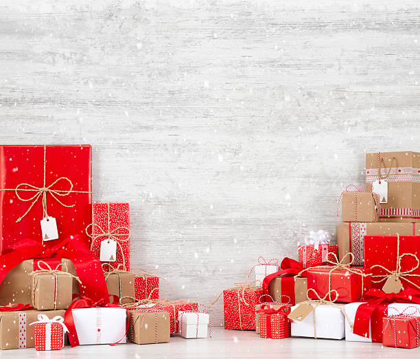 istock Christmas Gift Boxes on Snowy Wooden Background 618615202