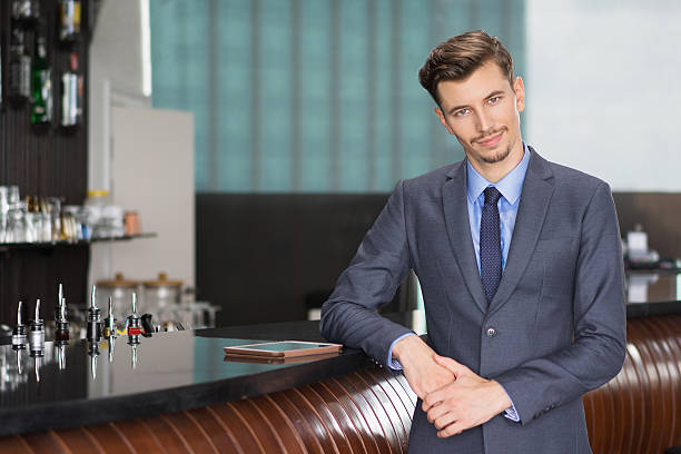 istock Friendly Middle-aged Businessman at Cafe Counter 618615268