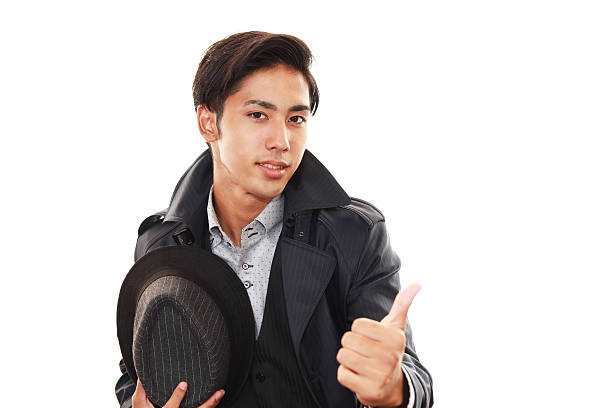 Asian business man showing thumbs up sign