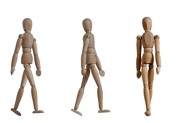 istock wooden mannequin walking gesture 618618768
