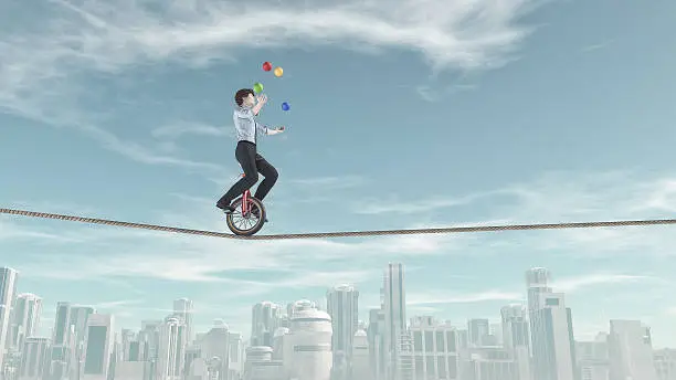 Extreme business man riding unicycle on a rope and juggling with some balls in the same time over the city. This is a 3d render illustration