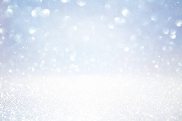 istock glitter vintage lights background. silver and white 618619624