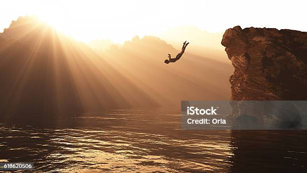 Jump From A Hill Stock Photo - Download Image Now - Jumping, Sea, Cliff