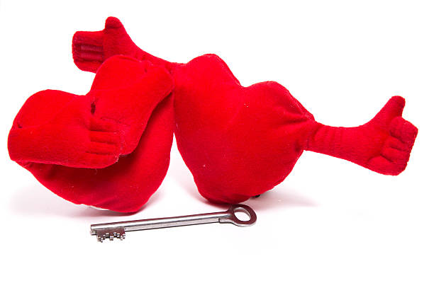 istock Two soft toy hearts with handles and key 618623448