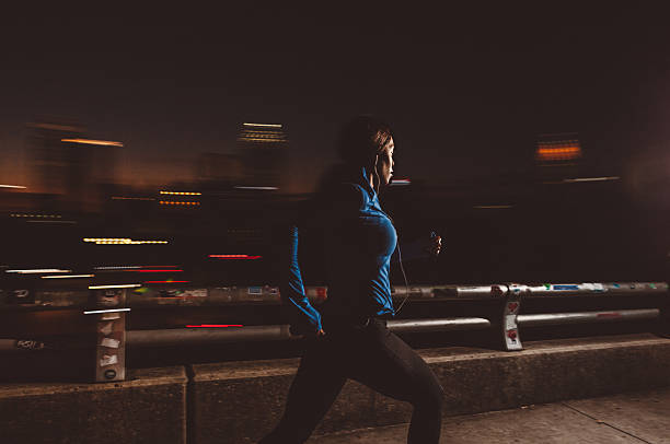 istock running at night in the city 618625862