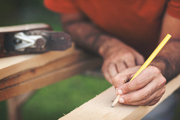 istock Marking the wooden board with crayon close up shot 618627192