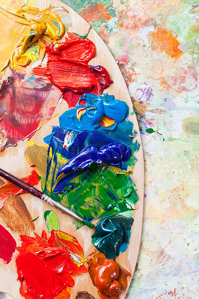 Painter's tools on table-palette Painter's tools on wooden table-palette. Close up. oil paint palette stock pictures, royalty-free photos & images