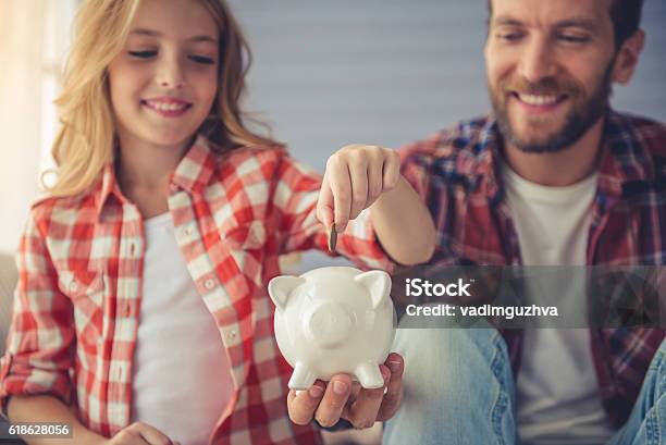 Father And Daughter Stock Photo - Download Image Now - Child, Savings, Currency