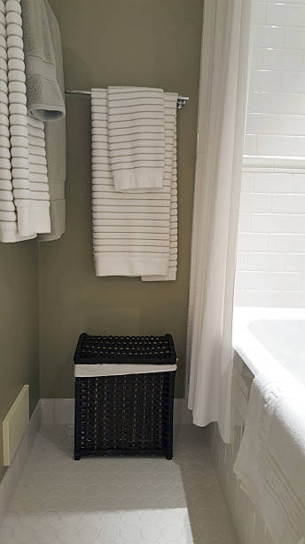 istock Partial Bathroom With Tub,Towels And Clothes Hamper 618628718