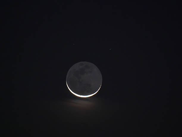 istock Earthshine of a crescent moon 618629020