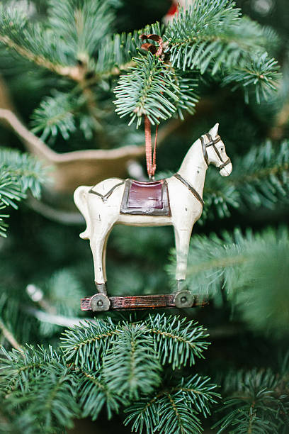 istock Old fashioned toy horse on Christmas tree 618629548