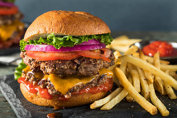 Homemade Cheese Smash Burger Homemade Cheese Smash Burger with Lettuce Tomato and Fries cheeseburger stock pictures, royalty-free photos & images