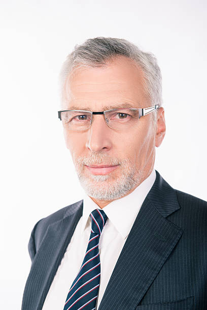 istock handsome old businessman in a business suit with glasses 618631114
