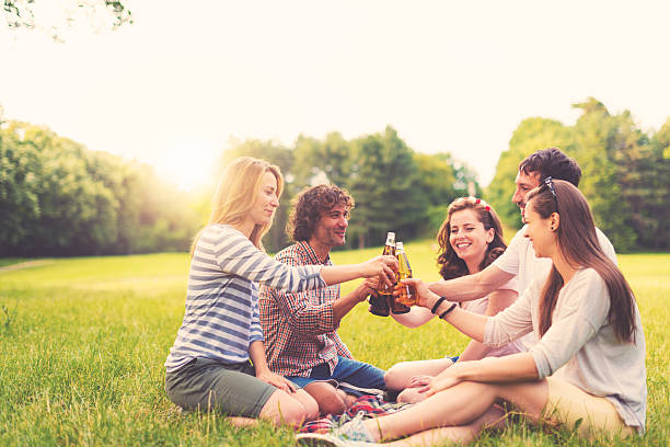 istock Group of friends having picnic in nature 618631208