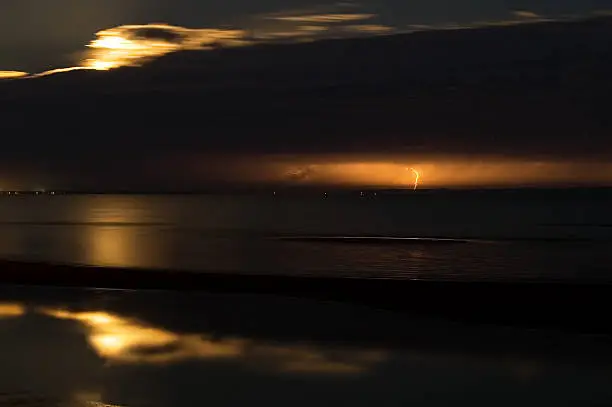 Photo of Lightning strike at night over Moreton Island in Queensland Australia