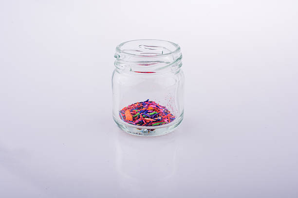 istock Little jar filled with color powder 618634716