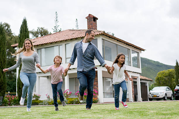 istock Happy family running at the backyard 618635440