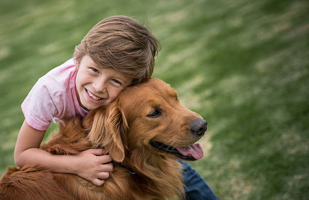 istock Happy boy with a beautiful dog 618635444