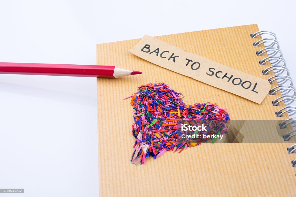 heart shape and color pencil Back to school written title, pencil and a heart shape on a notebook Abstract Stock Photo