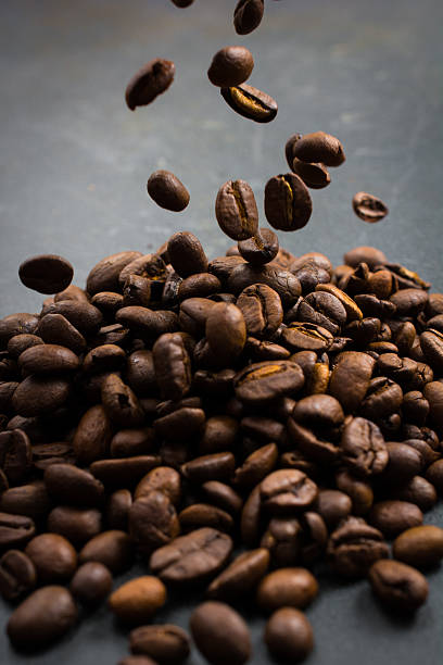 istock Pile of Roasted Coffee Beans with Falling Beans 618635992