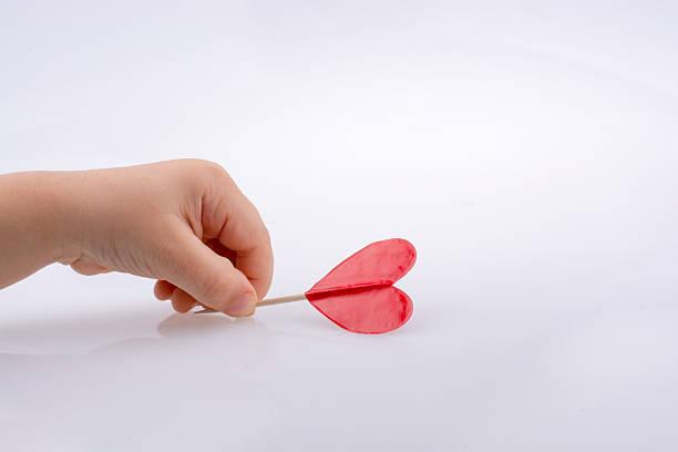 istock Little red color heart shape in hand 618636824