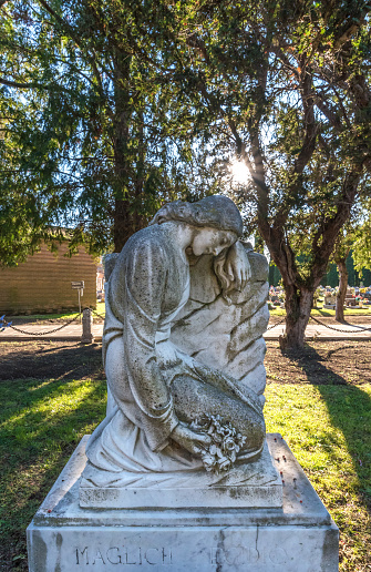 Venice, Italy - October 21, 2016: One of the most beautiful and least visited of Venice is its monumental cemetery, which occupies the entire island of San Michele. The island is located between Venice and Murano Cannaregio. The cemetery is divided into various areas housing the remains of some famous people such as Igor Stravinsky and Ezra Pound. Initially the island was divided in two, but in the course of 1800 was buried the channel that separated the two islands to create a single. In this photographic tour you can see some details of tombs and interesting architecture.