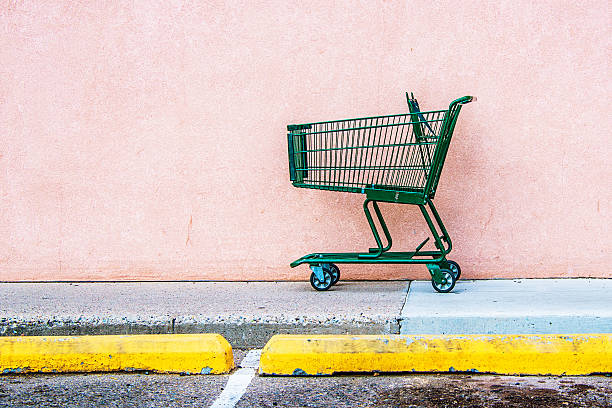 Abandoned Shopping Cart Abandoned Shopping Cart against Pink Wall abandoned stock pictures, royalty-free photos & images