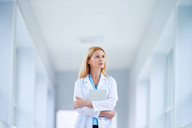 istock Female doctor in corridor 618641310