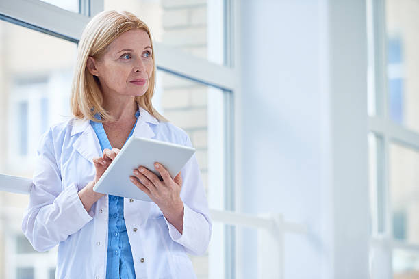 istock Female doctor with tablet 618641314