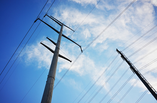 Outdoor utility pole, industrial lines, blue sky