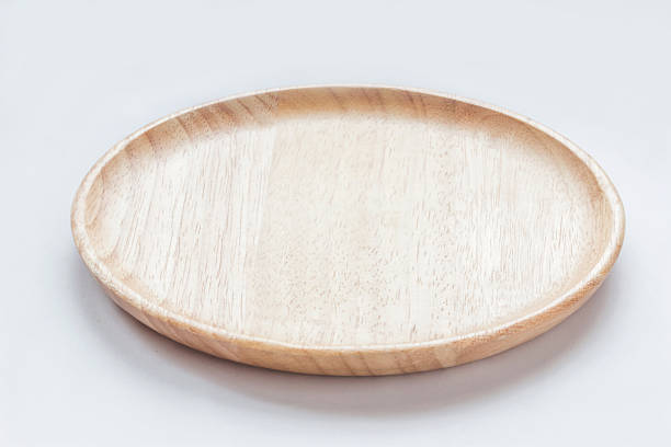 istock Close up empty flat wooden dish isolated on white background 618643012