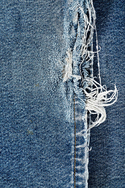 istock .Denim jeans texture or denim jeans background with old torn. 618643606