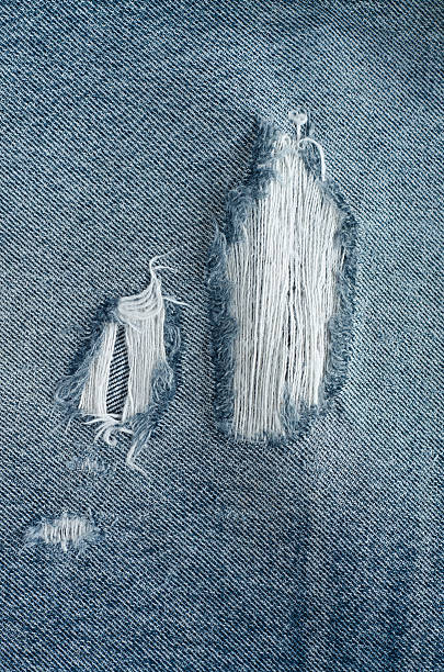 istock .Denim jeans texture or denim jeans background with old torn. 618643876