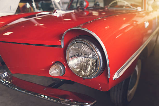 istock Close up headlight of red Retro classic car 618645020
