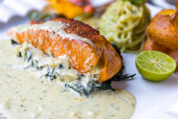 istock Grilled Salmon Fillet with Spinach and White Sauce 618645126