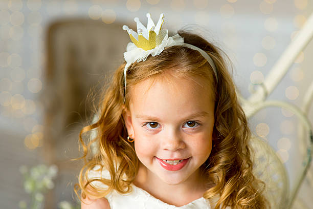 istock little princess sitting near the table 618646606