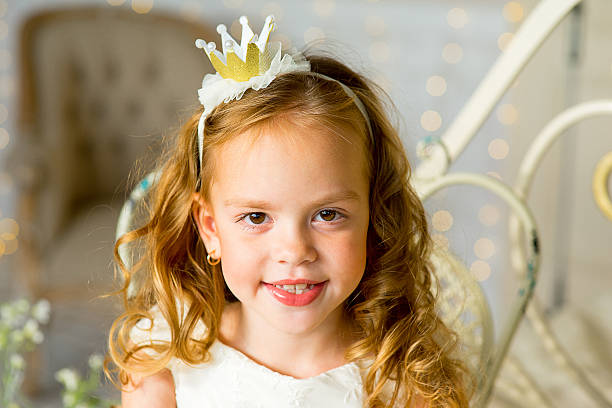 istock little princess sitting near the table 618646832