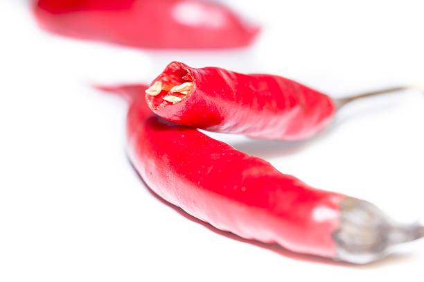 istock Red chili peppers isolated on white background 618648790