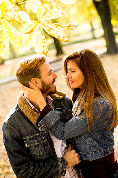istock Loving couple in the autumn park 618649680