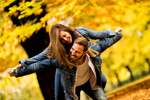 istock Young couple in the autumn park 618649684